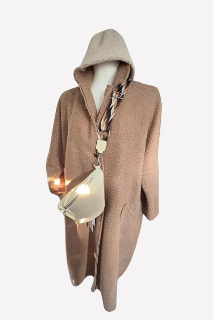 Der Mantel, der Komplimente sammelt