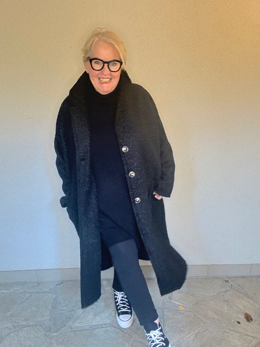 Der Mantel, der Komplimente sammelt